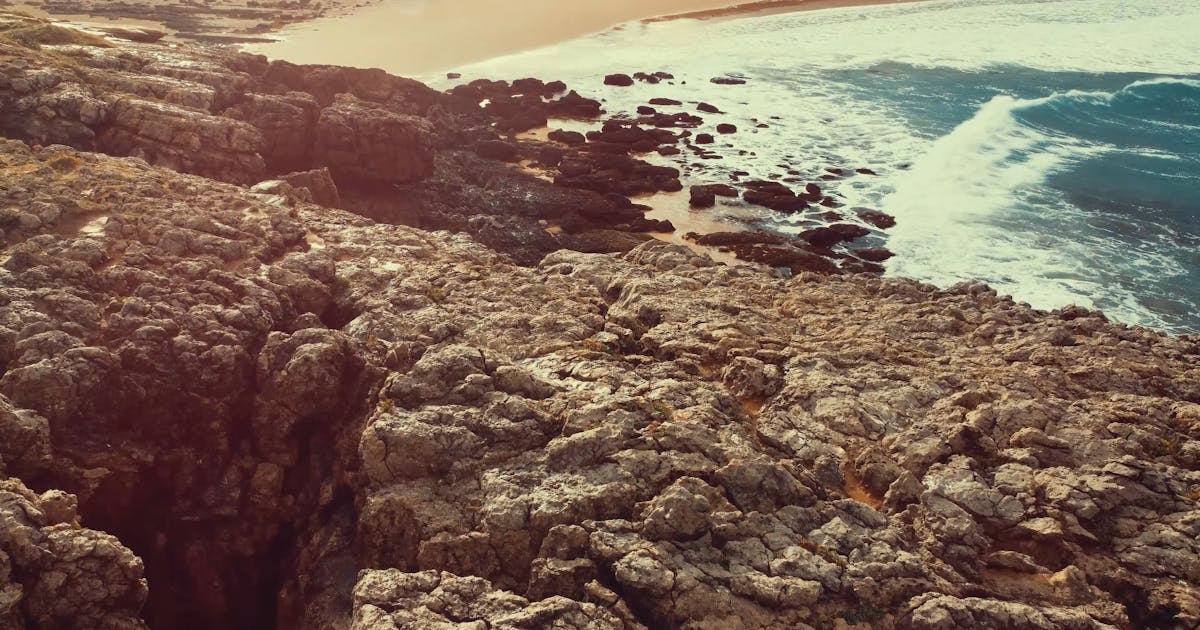 Aerial drone view of a Mediterranean coastline at golden hour